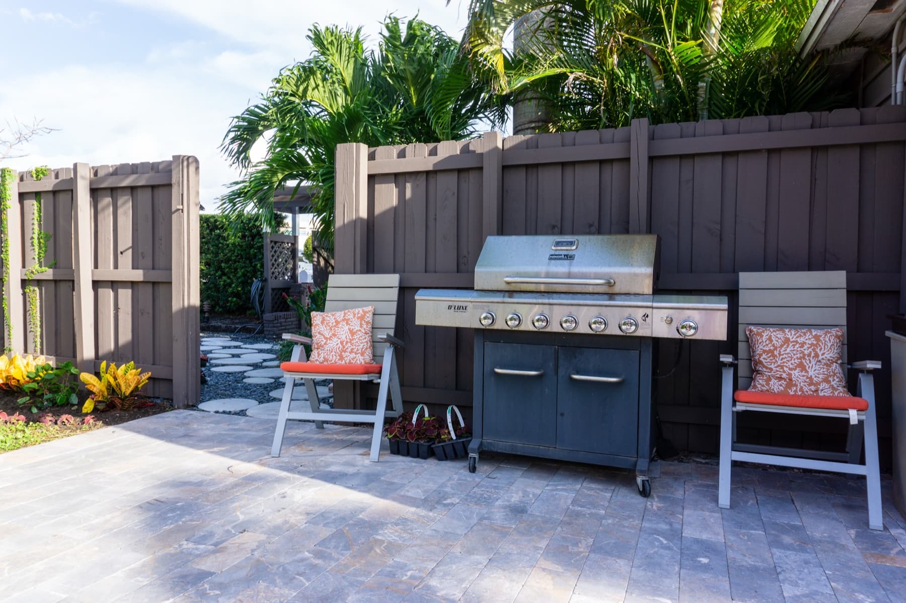 Outdoor grilling area with seating at Solstice at Wilton